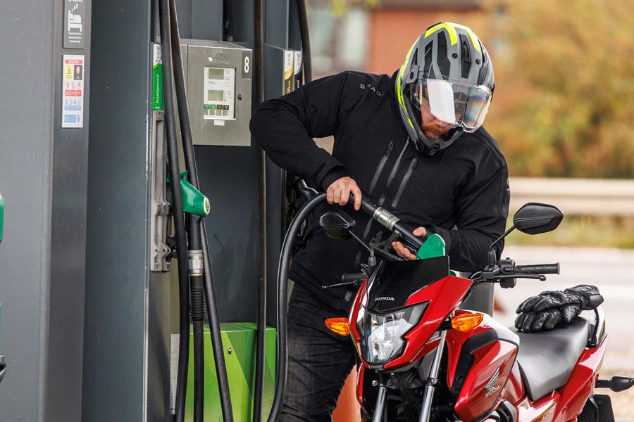 2026-on Honda CB125F filling up the tank at a petrol station