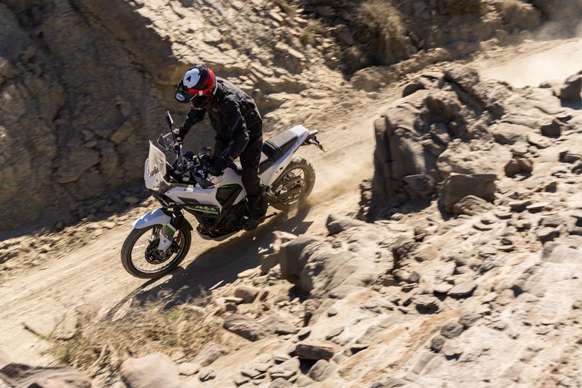 2026-on Kawasaki KLE500 riding down a trail