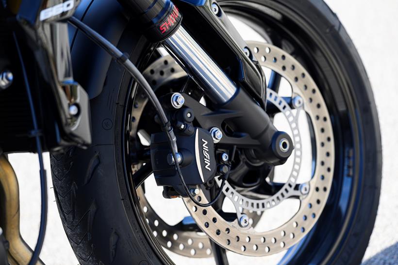 2026 Triumph Trident 660, close up of Nissin brakes and Michelin Road 5 tyres