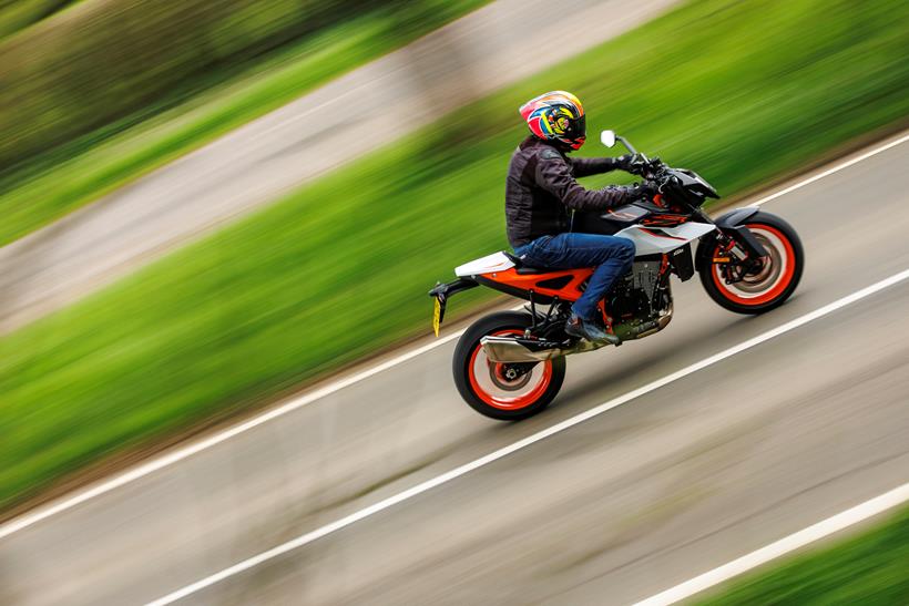 2026-on KTM 990 Duke R riding down a road