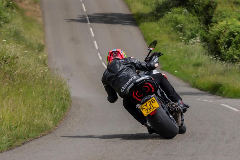 2026-on Ducati Diavel V4 RS throttle pinned exiting the corner