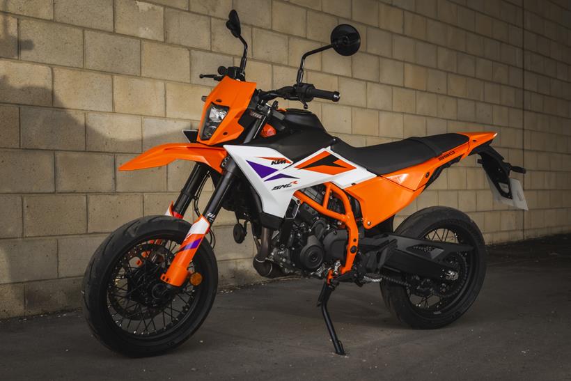 KTM 390 SMC-R, parked next to a wall