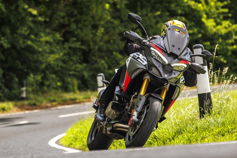 2026-on Ducati Multistrada V4 RS, leaning left on the road