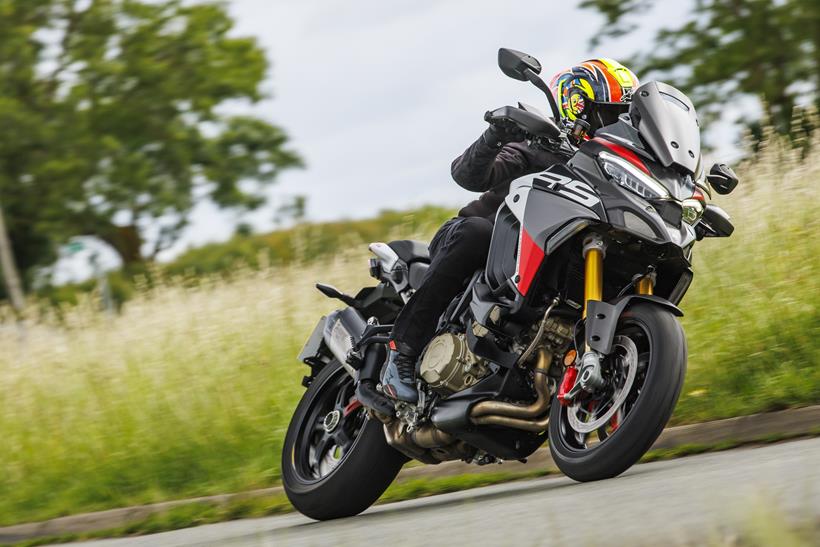 2026-on Ducati Multistrada V4 RS, leaning left on the road