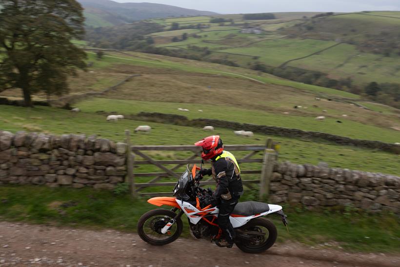2025-on KTM 390 Adventure R standing whilst riding down a lane