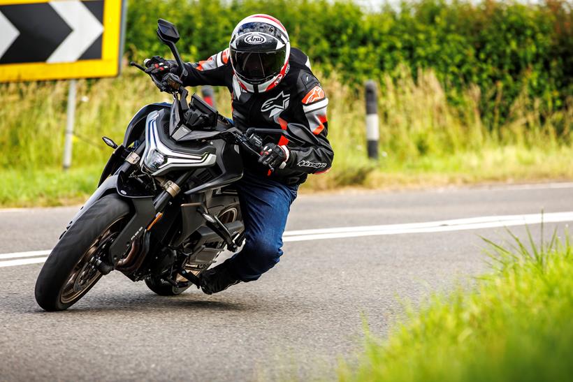 2024 CFMoto 800NK Advanced leaning into a left hand corner