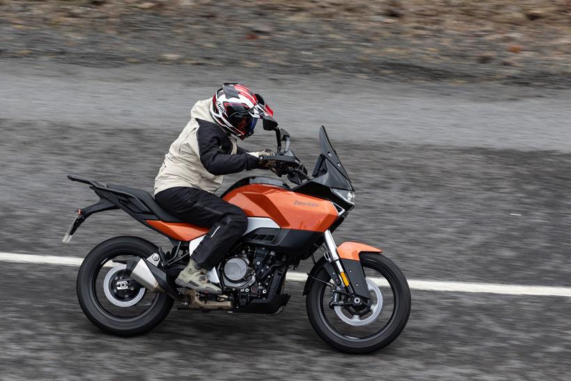 2027-on Norton Atlas Apex riding past on a grey Iceland backdrop